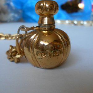 CHRISTIAN DIOR GOLD COLOR POISON PERFUME BOTTLE PL